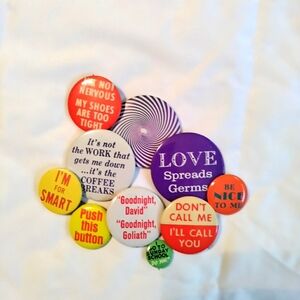 Vintage 10 metal buttons. Great potential for art pieces. Bright colors.